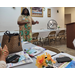 A woman giving a presentation inside a room.