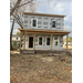 The front view of the house that is under construction.