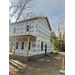 The view of the front porch of a house under construction.