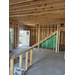 A wide view of the first level of a house under construction.