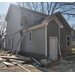 House getting siding and a new roof.