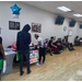 Various individuals at a barbershop. 