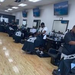  Barbers giving haircuts. 