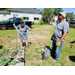  Two men working in the community garden. 
