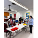  Students trying on life jackets. 