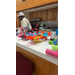  A countertop full of all the art project boats. 