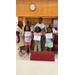  Six kids smile with their certificates of completion. 