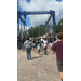  A large group of people walking thru the big machine that moves boats. 