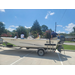  three kids and a teacher sit in the boat. 
