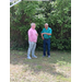  Two men stand and talk. 