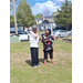  Two women stand and talk. 