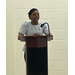  Shakiha Reid, FSS Coordinator, talking at a podium. 