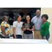  Lajoy smiling with members of the WAHANC staff. 