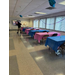  Tables decorated with pink and blue tablecloths. 