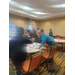  A group of people sit at a table. 