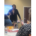  A woman gestures to a crowd. 