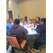  Staff members talk to one another. 