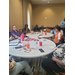  A large group of people sitting at tables. 