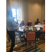  A man talks to people in a room. 