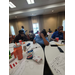  A group of people sitting at tables. 