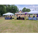  A wide view of three booths set up. 