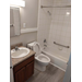 A bathroom including a sink, toilet, and tub. 