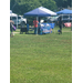  People standing under a tent. 