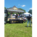  A view of a booth in the grass. 