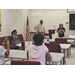  A man and a woman present to a room. 