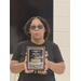  A woman holds her plaque up ot the camera. 