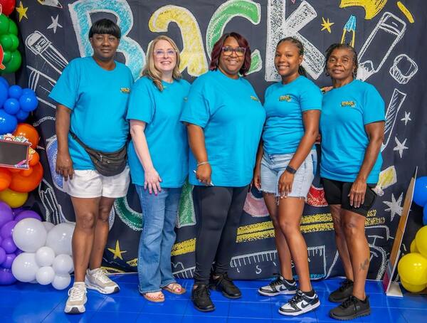 Volunteers smiling for a photo.
