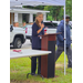  A woman speaks at a podium. 