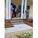  A family cuts a ribbon. 